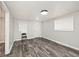 Open-concept living area with wood-look flooring, neutral walls, and great natural light at 715 N Warman Ave, Indianapolis, IN 46222