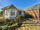 Brick ranch home with bay window and landscaping at 7704 Winding Creek Dr, Indianapolis, IN 46236