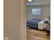 Bedroom with a double bed, light wood floors, and window at 8390 E Us 36 Hwy, Avon, IN 46123