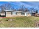 Ranch style home with brick exterior, landscaped lawn, and a spacious front yard at 8390 E Us 36 Hwy, Avon, IN 46123