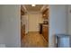 Simple kitchen with wood cabinets, laminate flooring, and white appliances at 8390 E Us 36 Hwy, Avon, IN 46123