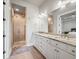 Spa-like bathroom with double vanity, granite countertop and large shower at 1023 Westview Point Dr, Columbus, IN 47201