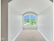 Small bedroom with arched window and carpet at 1023 Westview Point Dr, Columbus, IN 47201