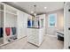 Large walk-in closet with custom built-ins and island at 1023 Westview Point Dr, Columbus, IN 47201