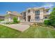 An eye-level view of this home's stylish architectural design, manicured lawn, and stone details at 1023 Westview Point Dr, Columbus, IN 47201