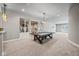 Basement game room with ping pong table and access to gym at 1023 Westview Point Dr, Columbus, IN 47201