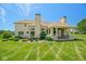 Beautiful backyard featuring a covered outdoor kitchen and lush green lawn at 1023 Westview Point Dr, Columbus, IN 47201