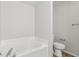 Bathroom with garden tub and toilet at 1127 Maple Stream Dr, Indianapolis, IN 46217