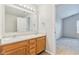Bathroom with double vanity and access to bedroom at 1127 Maple Stream Dr, Indianapolis, IN 46217