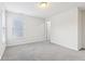 Bright bedroom with grey carpet, neutral walls, and a window with blinds at 1127 Maple Stream Dr, Indianapolis, IN 46217