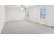 Bright bedroom with gray carpet and ceiling fan at 1127 Maple Stream Dr, Indianapolis, IN 46217