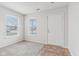 Bright foyer with gray carpet, neutral walls, and tile flooring at 1127 Maple Stream Dr, Indianapolis, IN 46217