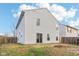 Two-story house back with a patio and fenced yard at 1127 Maple Stream Dr, Indianapolis, IN 46217