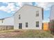 Two-story house back with a patio and fenced yard at 1127 Maple Stream Dr, Indianapolis, IN 46217