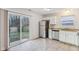 Kitchen features granite countertops, stainless steel appliances, and a back door at 1127 Maple Stream Dr, Indianapolis, IN 46217
