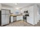 Kitchen with granite countertops, stainless steel appliances and white cabinets at 1127 Maple Stream Dr, Indianapolis, IN 46217