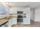 Kitchen with granite countertops, stainless steel appliances, and white cabinets at 1127 Maple Stream Dr, Indianapolis, IN 46217