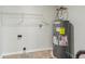 Laundry room with a new water heater and shelving at 1127 Maple Stream Dr, Indianapolis, IN 46217