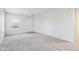 Spacious living room with grey carpet and an entryway at 1127 Maple Stream Dr, Indianapolis, IN 46217