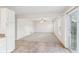 Spacious living room with gray carpet and sliding door at 1127 Maple Stream Dr, Indianapolis, IN 46217