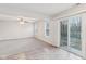 Bright living room with gray carpet and sliding door at 1127 Maple Stream Dr, Indianapolis, IN 46217