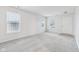 Bright living room features grey carpet, neutral walls and two windows at 1127 Maple Stream Dr, Indianapolis, IN 46217
