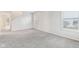Spacious living room with gray carpet and neutral walls at 1127 Maple Stream Dr, Indianapolis, IN 46217