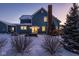 Back of house showing backyard, patio, and winter landscaping at 13139 Broad St, Carmel, IN 46032