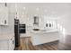 Modern kitchen with white cabinets, stainless steel appliances, and an island at 1500 Chatham Village Blvd, Westfield, IN 46074