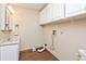 Bright laundry room, with a sink, cabinets and washer/dryer hookups at 1507 N County Road 600 E, Avon, IN 46123