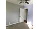 Bedroom with gray and purple walls, ceiling fan and carpet flooring at 1513 Laurel Dr, Columbus, IN 47203