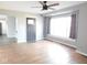 Living room with hardwood floors and ceiling fan at 1513 Laurel Dr, Columbus, IN 47203