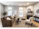 Living room features hardwood floors, fireplace, and large windows at 220 N East St, Indianapolis, IN 46204