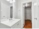 Simple bathroom with white vanity and access to bedroom at 2314 E 58Th St, Indianapolis, IN 46220