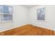 Bright bedroom with hardwood floors and two windows at 2314 E 58Th St, Indianapolis, IN 46220