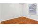 Bright bedroom with hardwood floors and a window at 2314 E 58Th St, Indianapolis, IN 46220