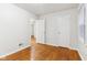 Bedroom with hardwood floors and access to other rooms at 2314 E 58Th St, Indianapolis, IN 46220