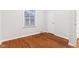 Simple bedroom with hardwood floors and window at 2314 E 58Th St, Indianapolis, IN 46220