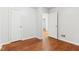 Bedroom with hardwood floors and access to other rooms at 2314 E 58Th St, Indianapolis, IN 46220