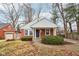 Brick ranch house with a white upper story and a landscaped yard at 2314 E 58Th St, Indianapolis, IN 46220