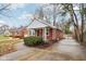 Red brick ranch house with a covered porch and a driveway at 2314 E 58Th St, Indianapolis, IN 46220