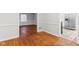 Hardwood floor hallway connecting dining and kitchen areas at 2314 E 58Th St, Indianapolis, IN 46220