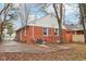 Brick house exterior with a spacious backyard and concrete patio at 2314 E 58Th St, Indianapolis, IN 46220
