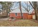 Brick house exterior with a spacious backyard and concrete patio at 2314 E 58Th St, Indianapolis, IN 46220