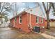 Brick house exterior with a spacious backyard and concrete patio at 2314 E 58Th St, Indianapolis, IN 46220