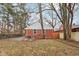 Brick house exterior with a spacious backyard and concrete patio at 2314 E 58Th St, Indianapolis, IN 46220