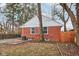 Brick house exterior with a spacious backyard and concrete patio at 2314 E 58Th St, Indianapolis, IN 46220