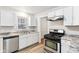 Updated kitchen with stainless steel appliances and granite counters at 2314 E 58Th St, Indianapolis, IN 46220