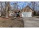 Brick ranch home with attached garage and landscaping at 2914 Rothe Ln, Indianapolis, IN 46229