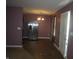 Dining area with hardwood floors and a stainless steel refrigerator at 317 N Bradley Ave, Indianapolis, IN 46201